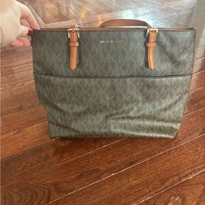 Classic Michael Kors, leather tote with gold hardware.